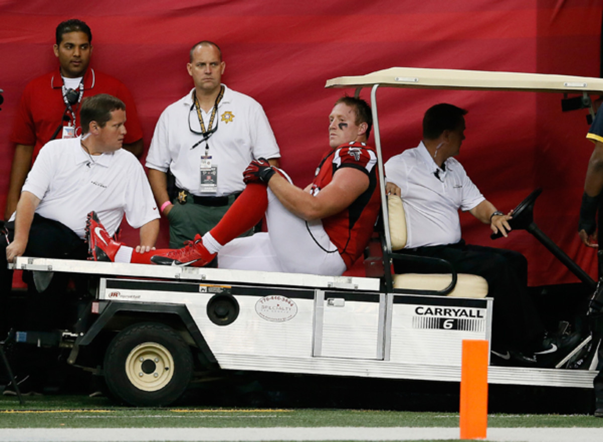 Kroy Biermann's injury was a major problem for Atlanta's defense. (Kevin C. Cox/Getty Images)