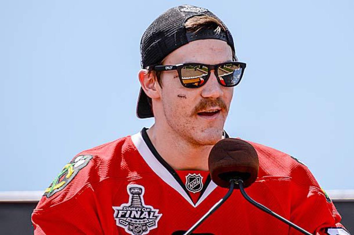 Andrew Shaw of the Chicago Blackhawks displays his stitches.