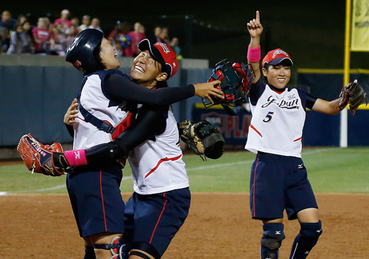 Yukiyo Mine (left), Kana Nakano (center) and Yuki Hayashi celebrate Japan's world title win.