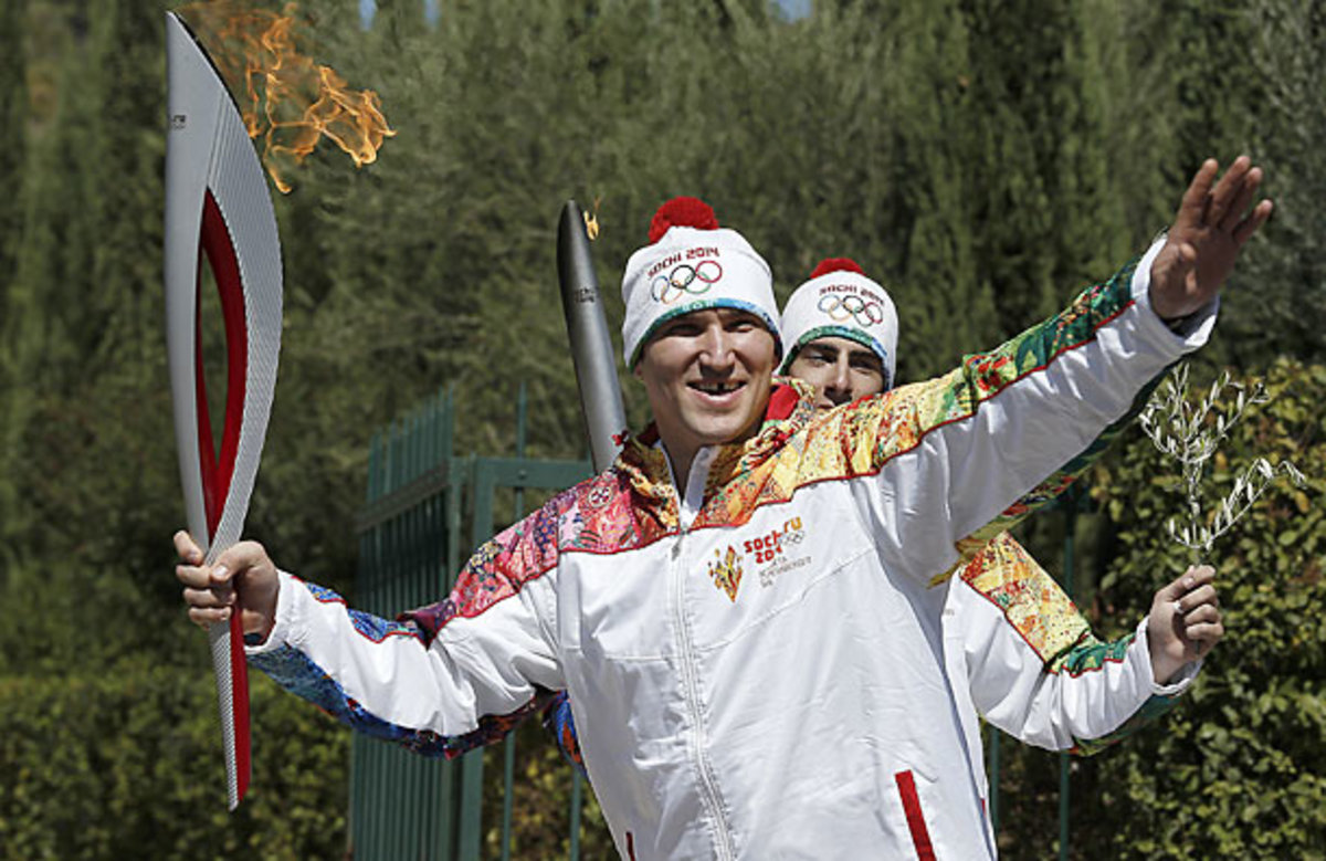 Alex Ovechkin carrying the Sochi Winter Olympics torch.