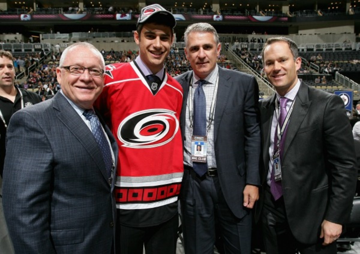 Fired Hurricanes executive Jason Karmanos helped welcome Daniel Altshuller in 2012. (Dave Sandford/NHL/Getty Images)
