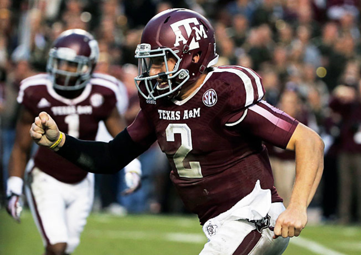 Johnny Manziel passed for 446 yards with five TDs in Texas A&M's 51-41 victory over Mississippi State.