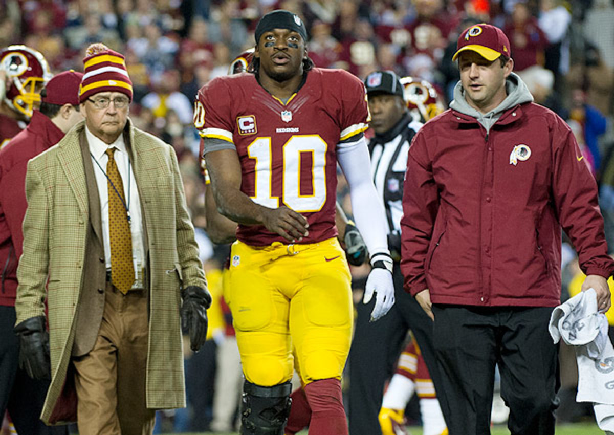 Dr. James Andrews (left) cleared Robert Griffin III to play, only to express concerns about his usage.