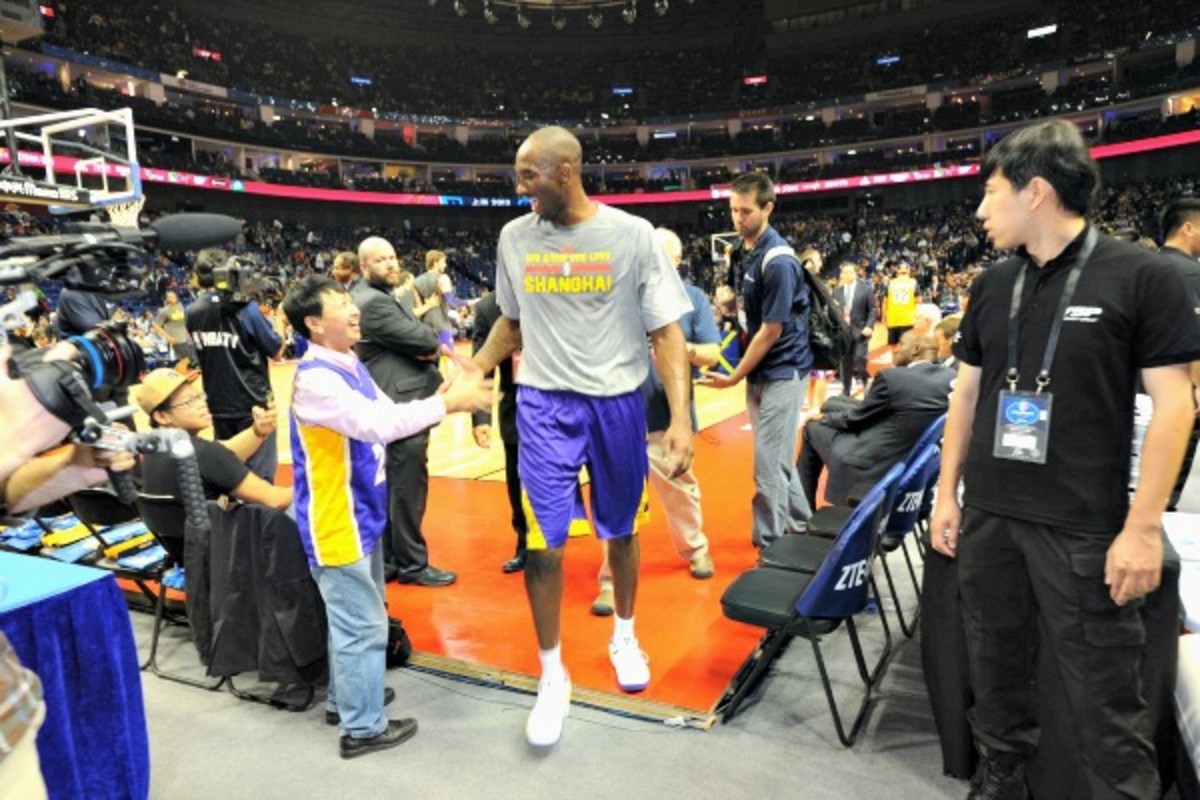 Kobe Bryant is continuing his rehab in China as the Lakers play preseason games. (Andrew D. Bernstein/Getty Images)