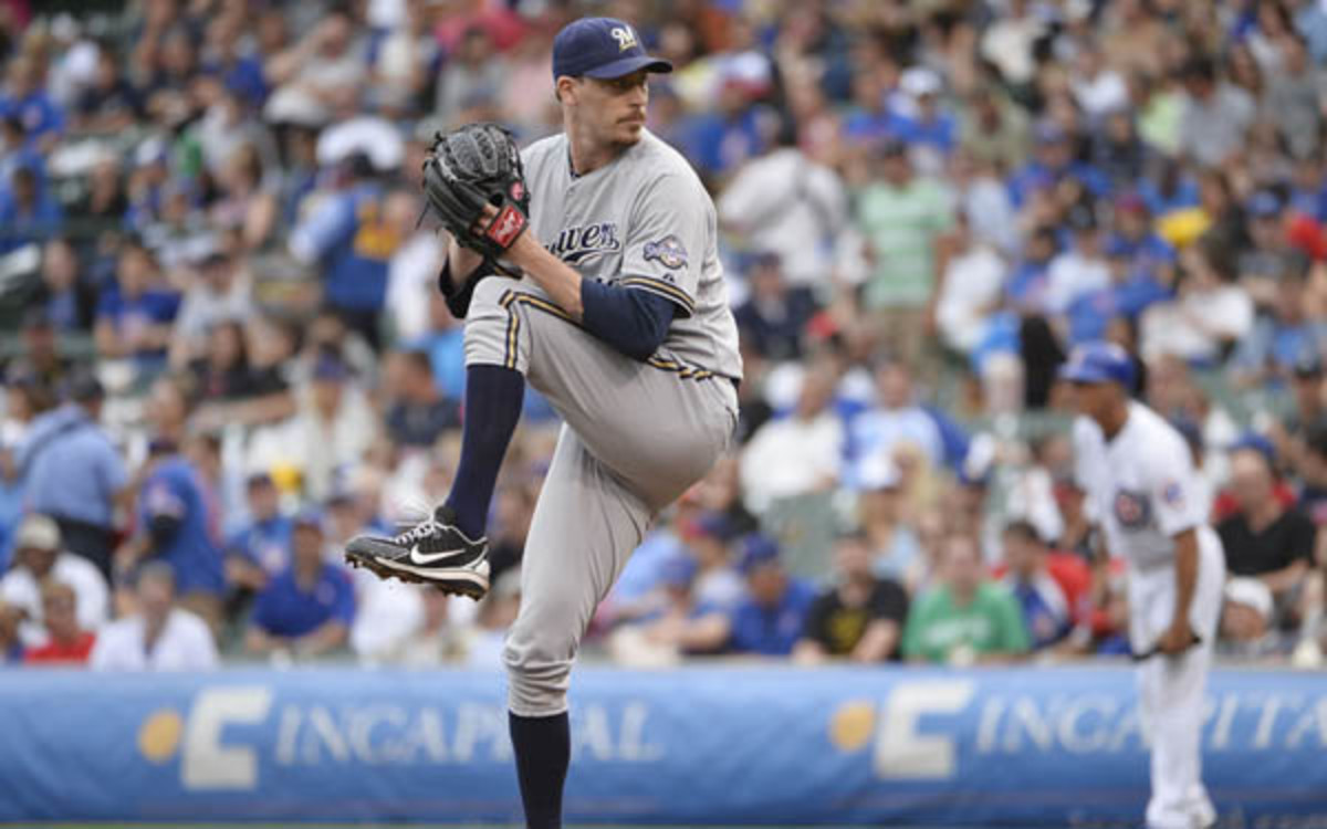Reliever John Axford was traded from the Brewers to the Cardinals. (Brian D. Kersey/Getty Images)