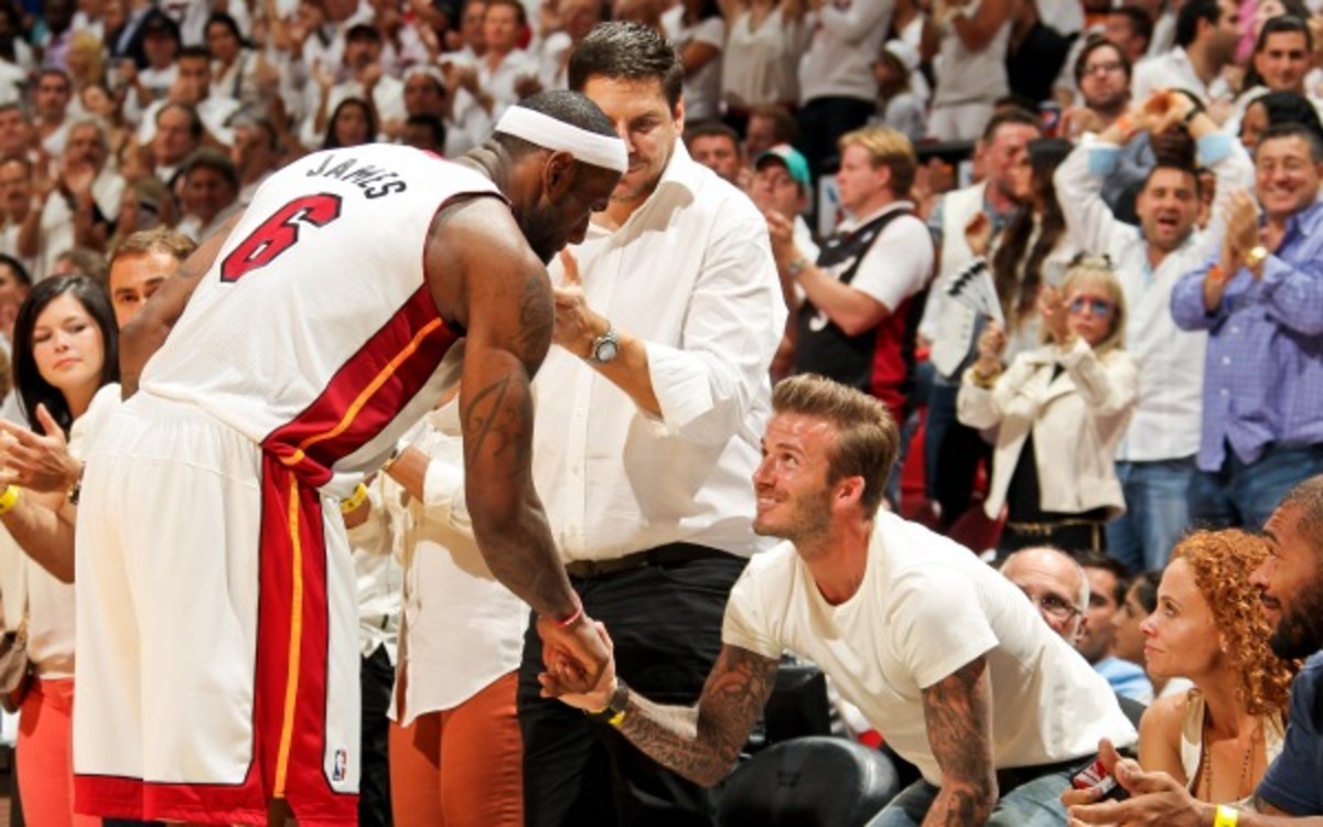 Heat forward LeBron James is seen at the NBA Finals with David Beckham. (Issac Baldizon/NBAE via Getty Images)