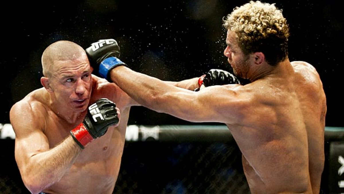 Georges St.-Pierre (left) will be seeking his eighth straight successful title defense in UFC 158.