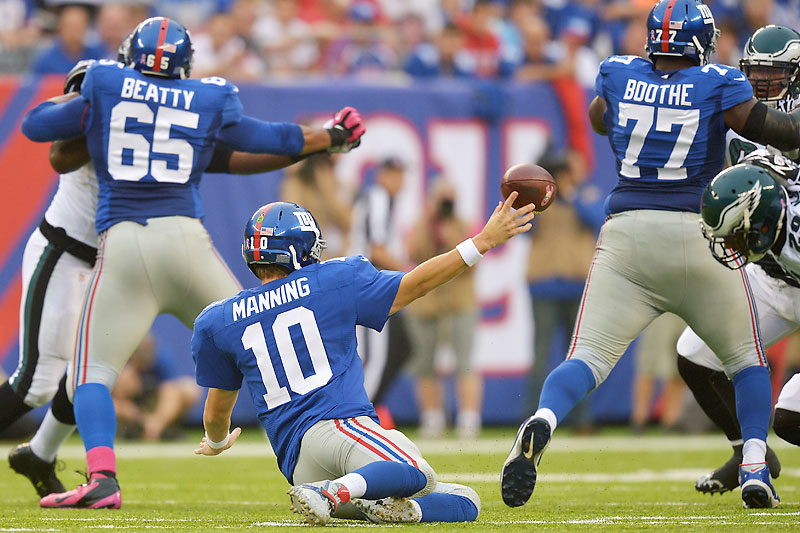 Yep, it’s been that kind of start for Eli Manning, who’s been forcing passes thanks to breakdowns in his blocking. (Drew Hallowell/Philadelphia Eagles/Getty Images)