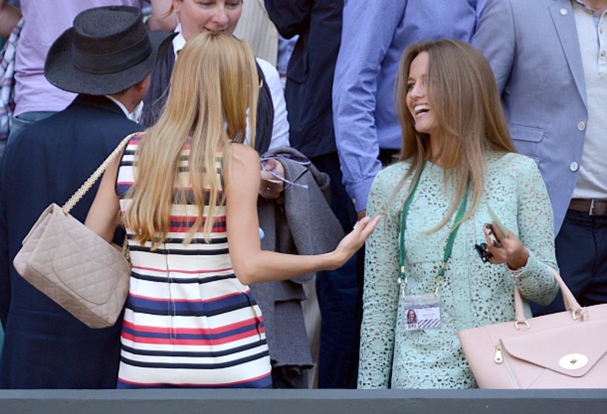 Andy Murray's girlfriend, Kim Sears, greets Novak Djokovic's girlfriend, Jelena Ristic. (Karwai Tang/WireImage/Getty Images)