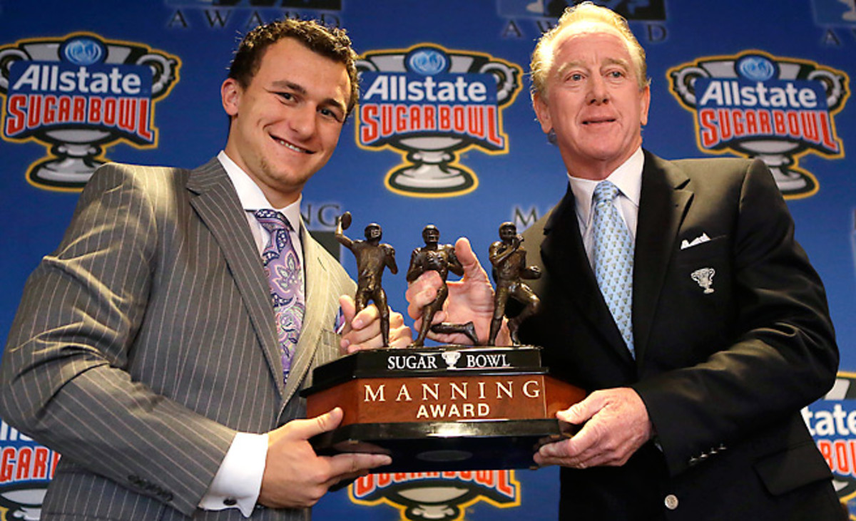 Johnny Manziel (left) was given the Manning Award, honoring the nation's best QB and named after Archie Manning (right), in May.