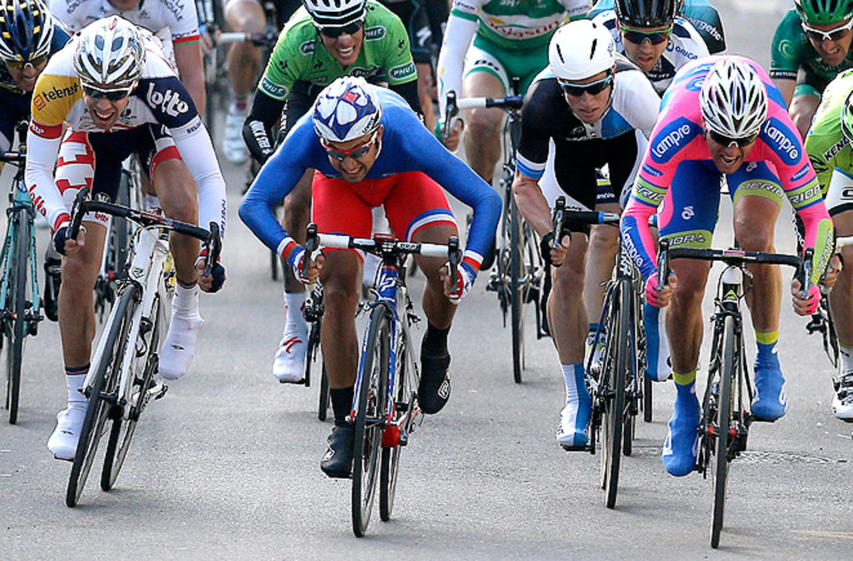 France's Nacer Bouhanni, center, outpedaled Italy's Alessandro Petacchi, right, to win the first stage of Paris-Nice.