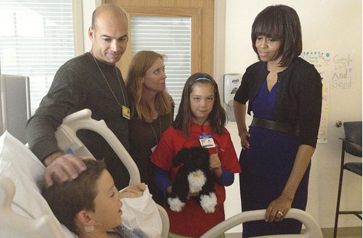 Josh Reddick and Brandon Moss visit young bombing victim Sports