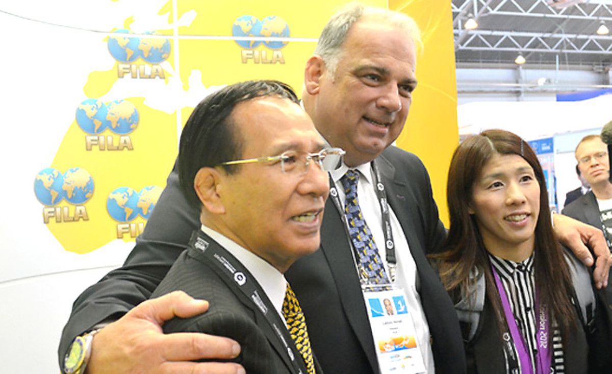 FILA, wrestling's governing body, quickly changed president to Nenad Lalovic (center) as part of its efforts to regain Olympic status.
