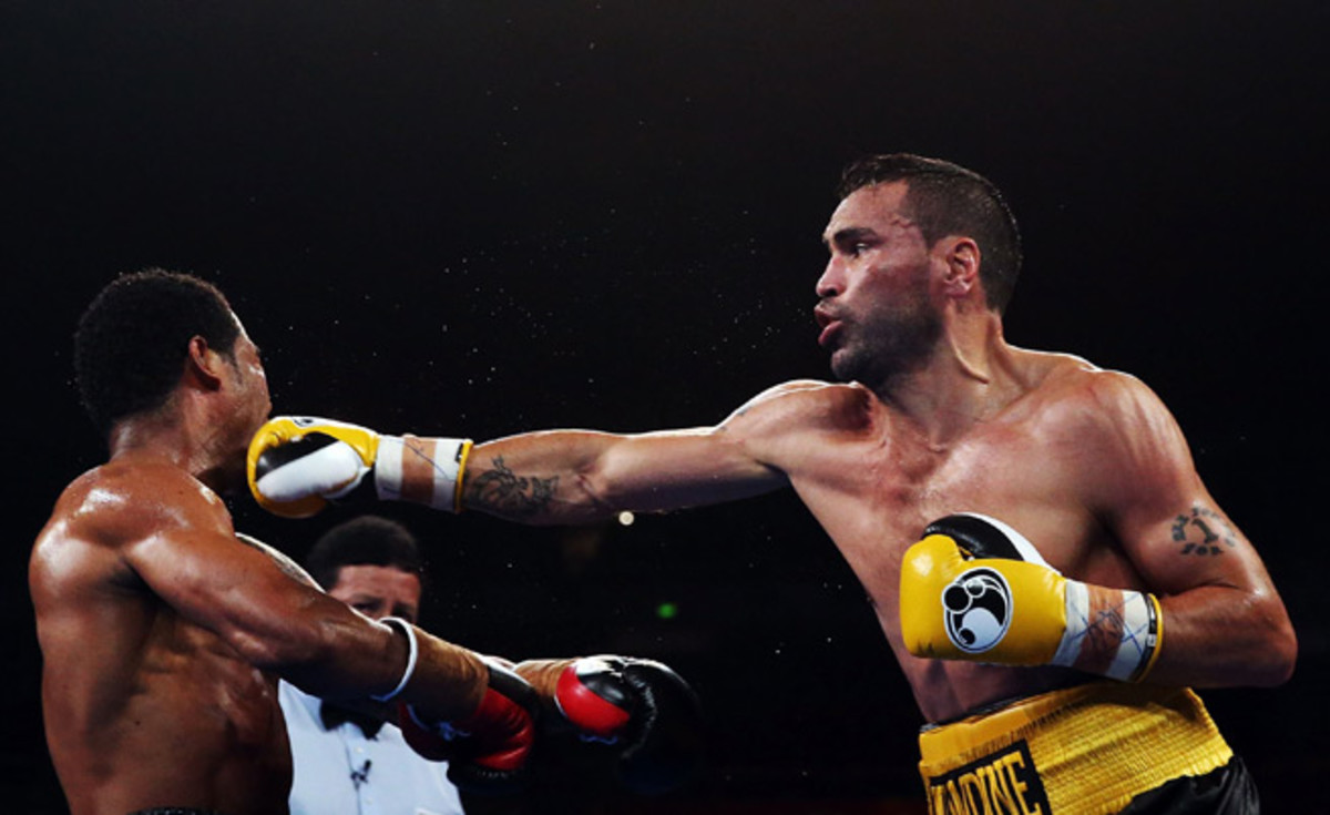 Anthony Mundine lands a right on Shane Mosley in their WBA international super welterweight bout in Sydney, Australia, on Wednesday.