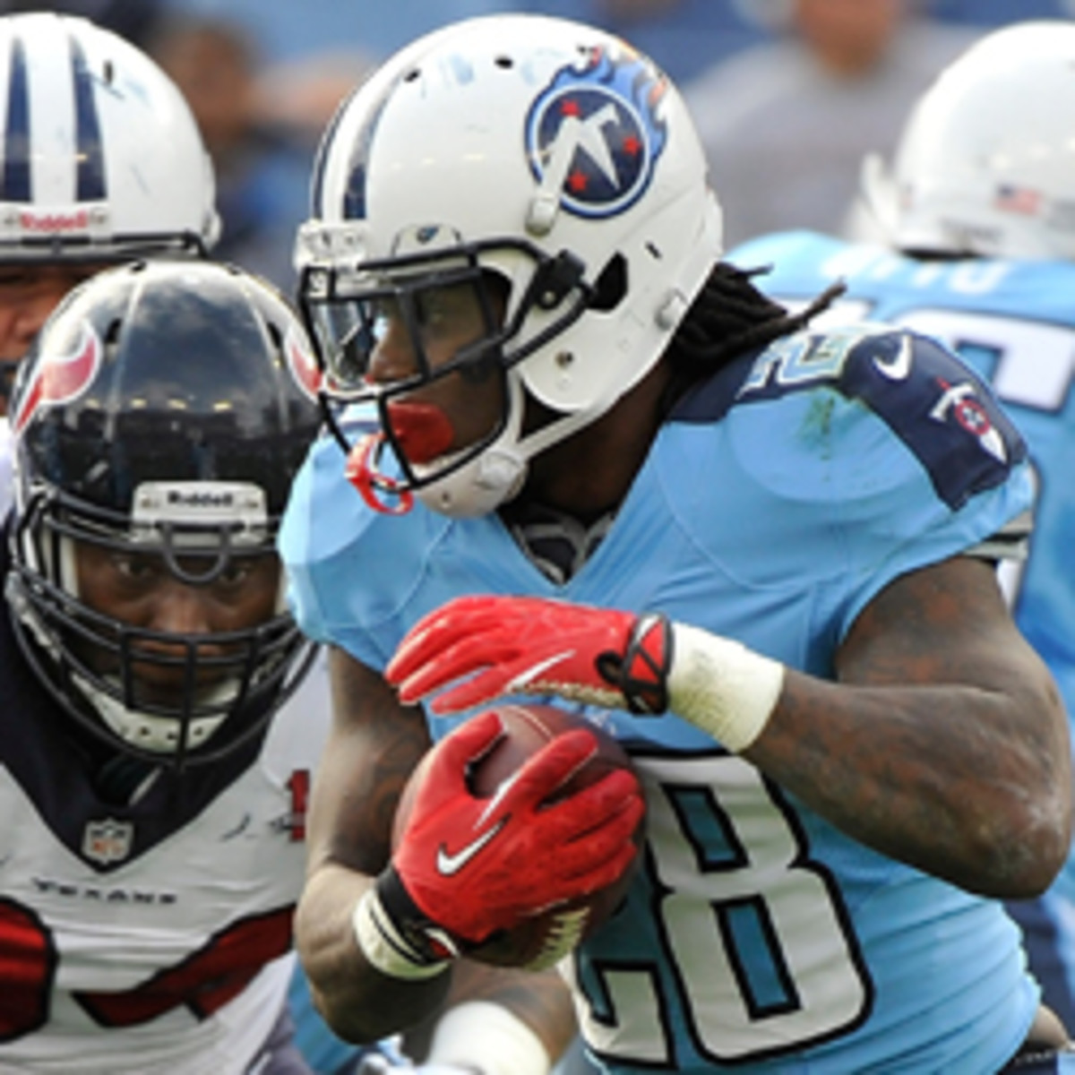 Chris Johnson had just three carries in the second half of the Titans' loss to the Texans. (Frederick Breedon/Getty Images)