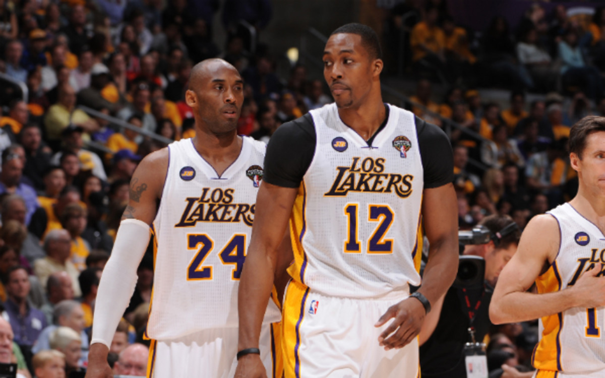 Kobe Bryant says it's imperative that the Lakers re-sign Dwight Howard. (Andrew D. Bernstein/Getty Images)