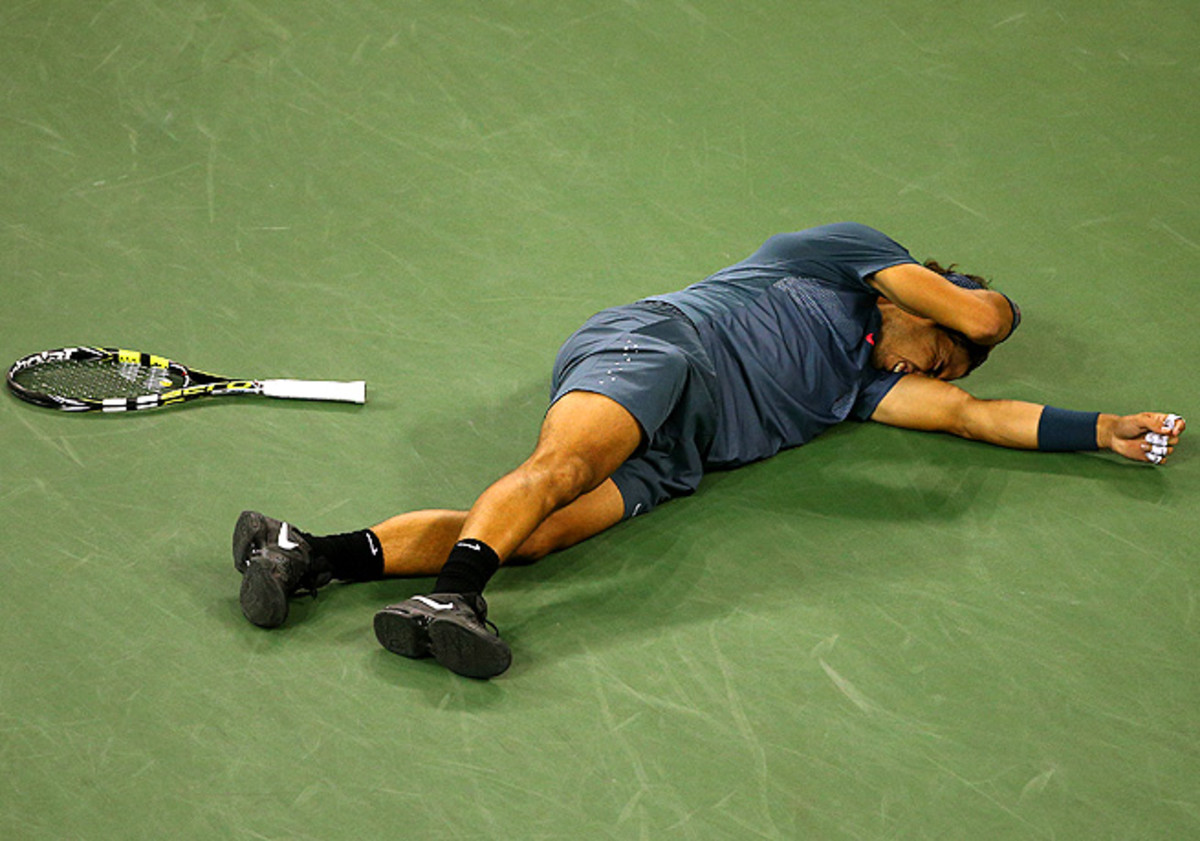 Rafael Nadal collapsed to the court after beating Novak Djokovic to win his second U.S. Open title. 