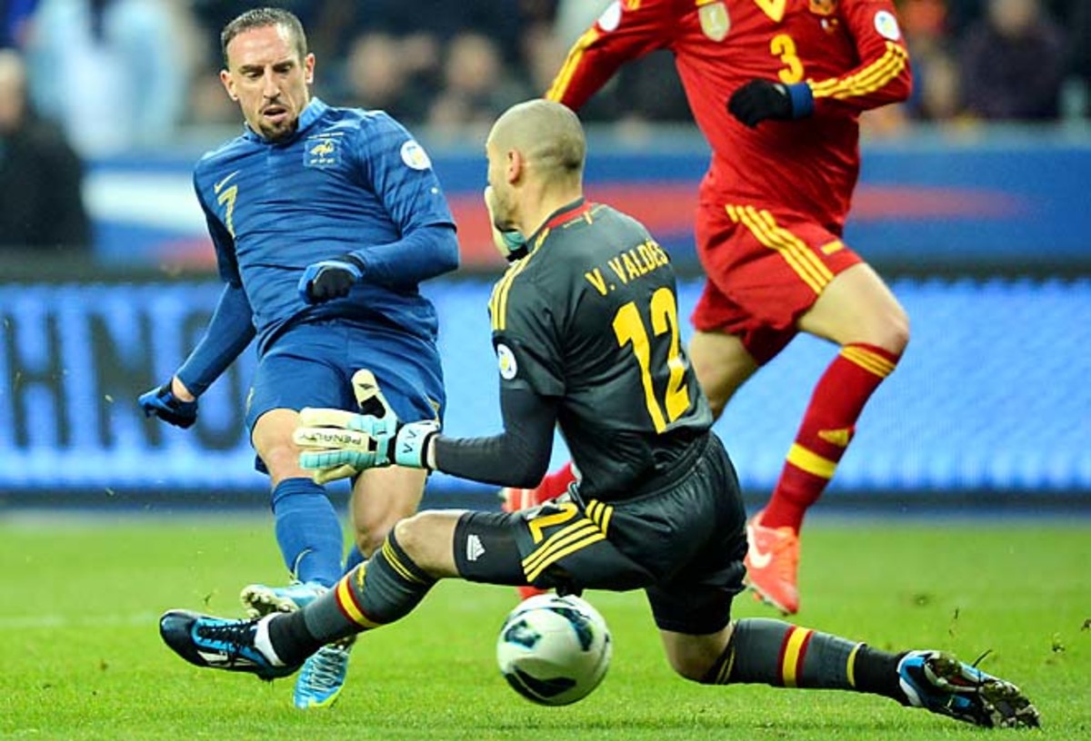 Spanish goalkeeper Victor Valdes stops a Franck Ribery shot in a 2-1 win over France.