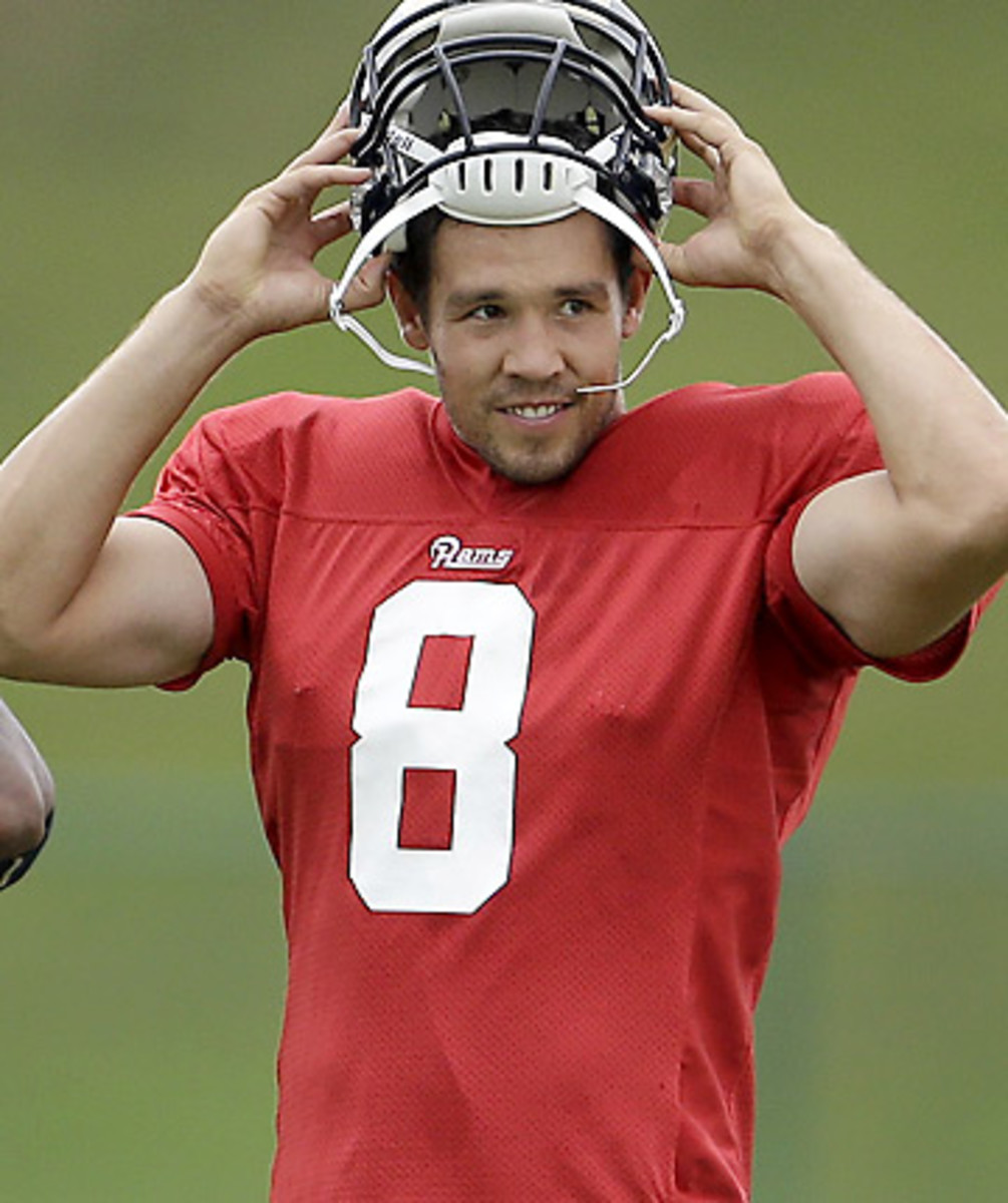 The Rams appear poised to go to a spread option offense, one that suits Sam Bradford well. (Jeff Roberson/AP)