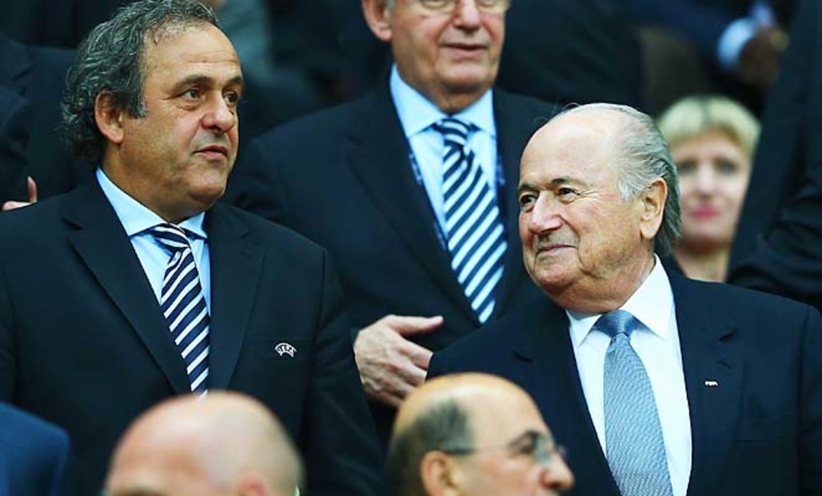 Michel Platini (left) and Sepp Blatter sit near each other at the Euro 2012 semifinals.