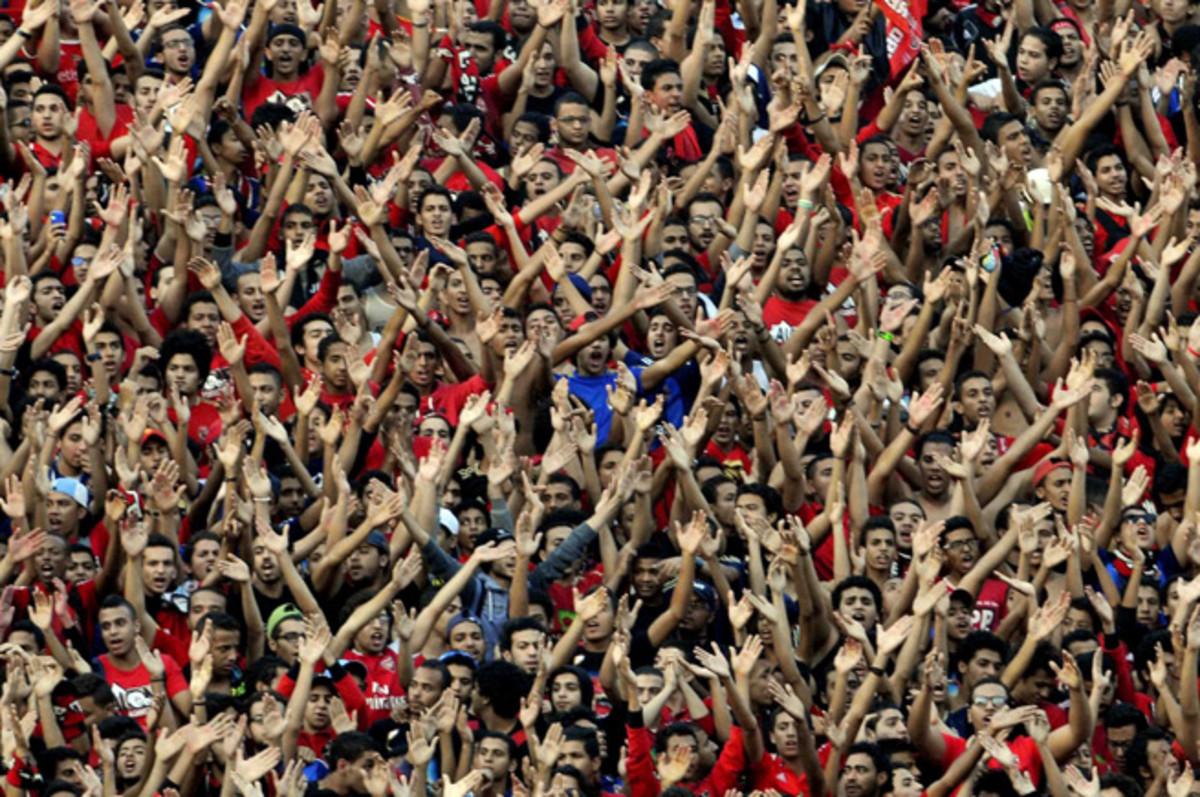 Al Ahly fans cheer during the second leg of the African Champions League final.