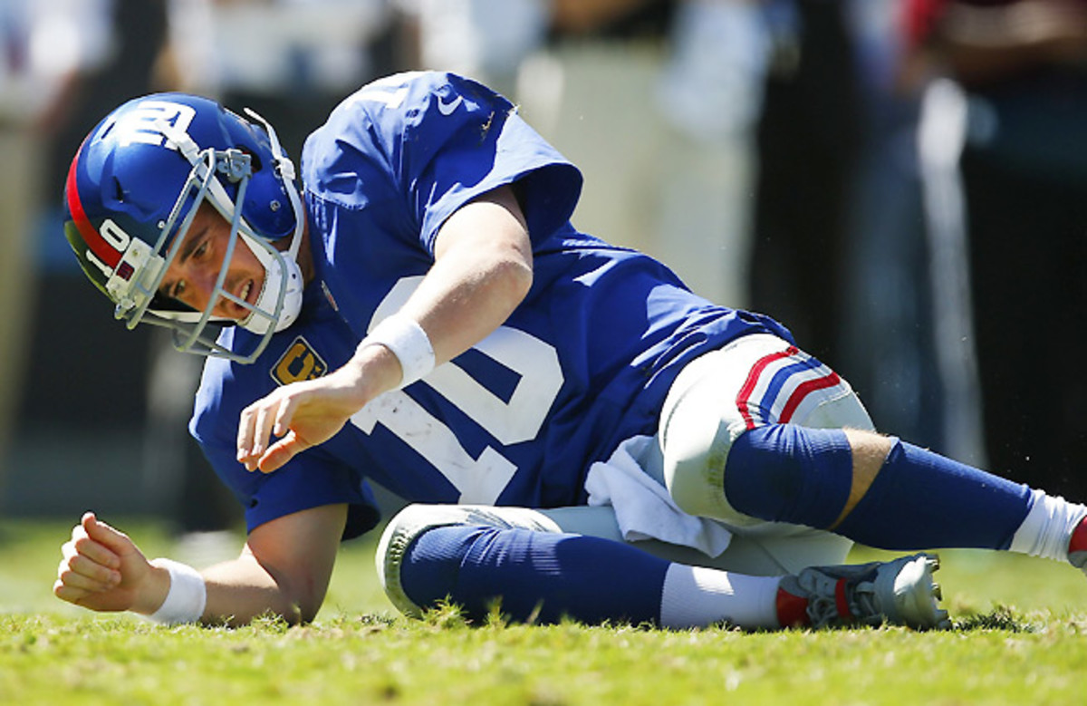 Eli Manning was sacked seven times in a loss to the Panthers that dropped the Giants to 0-3.