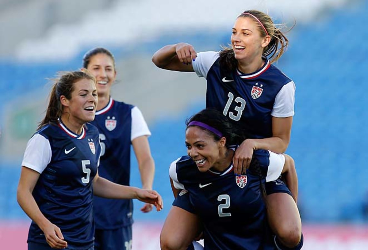 Alex Morgan celebrates on the shoulders of Sydney Leroux after scoring the opening goal.