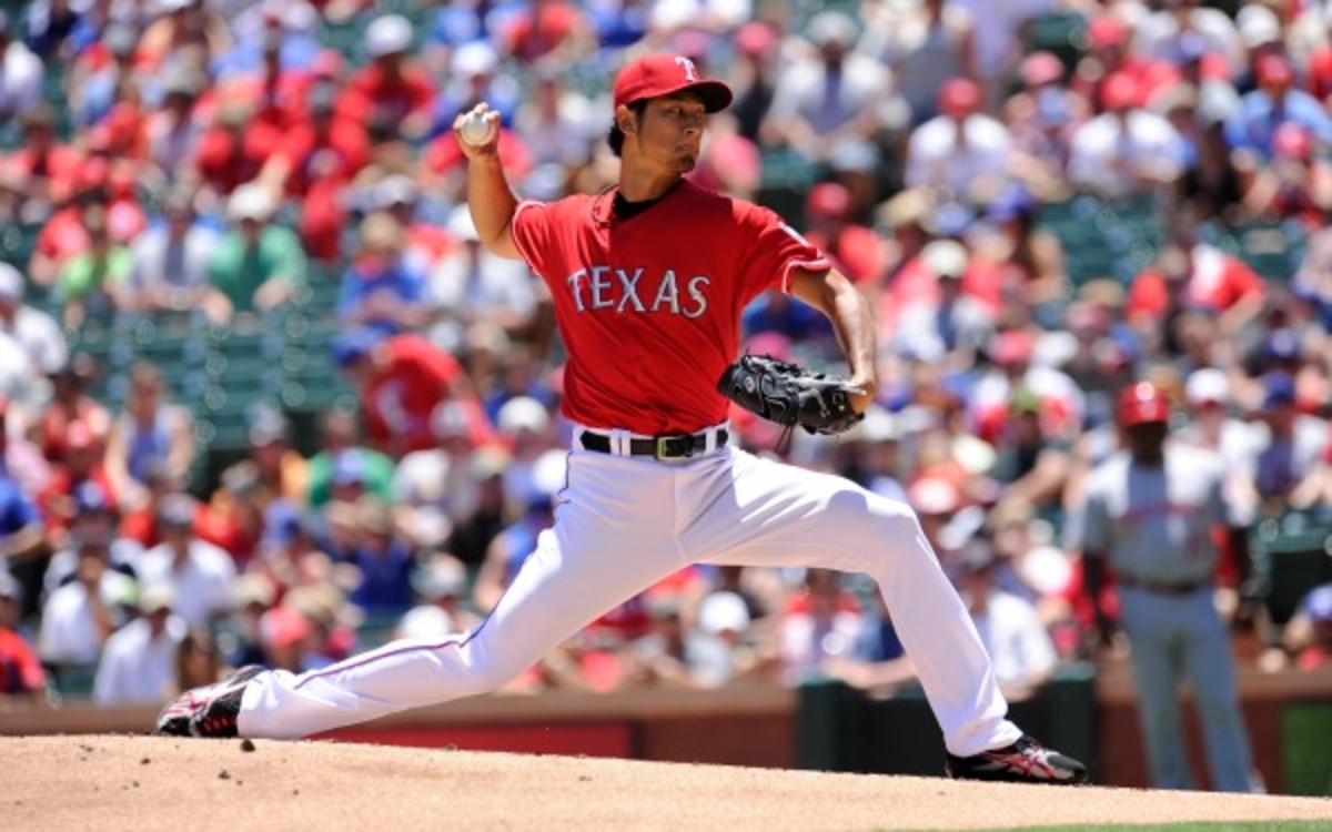 The Rangers placed Yu Darvish on the DL with a with right trap strain. (John Williamson/Getty Images)