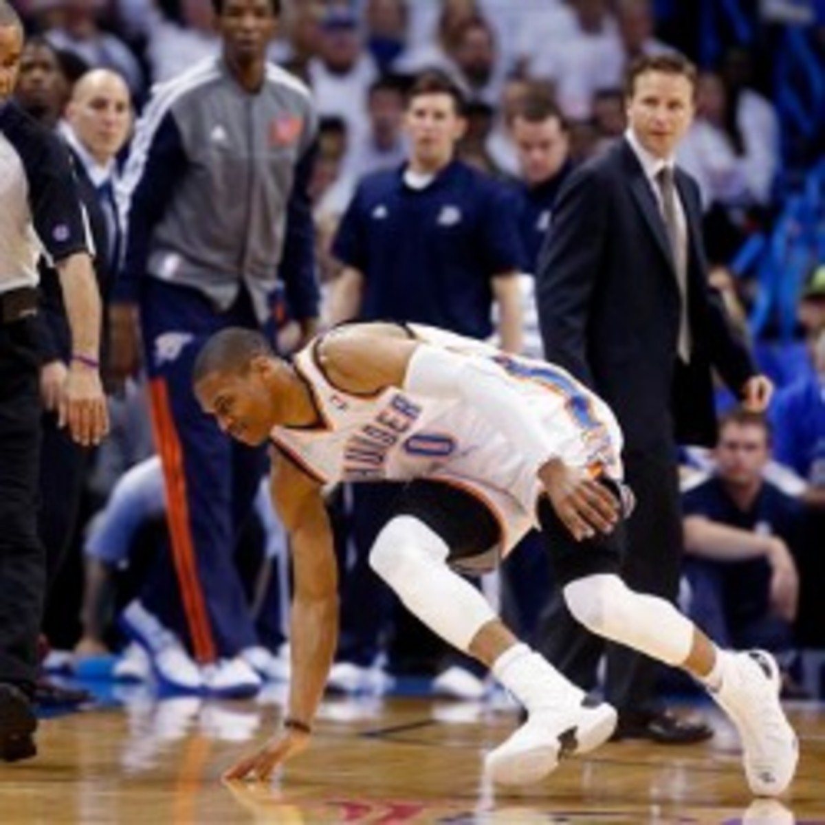 Thunder guard Russell Westbrooks attempts to get up after being injured in Game 2 against the Rockets. (AP Photo/Sue Ogrocki)