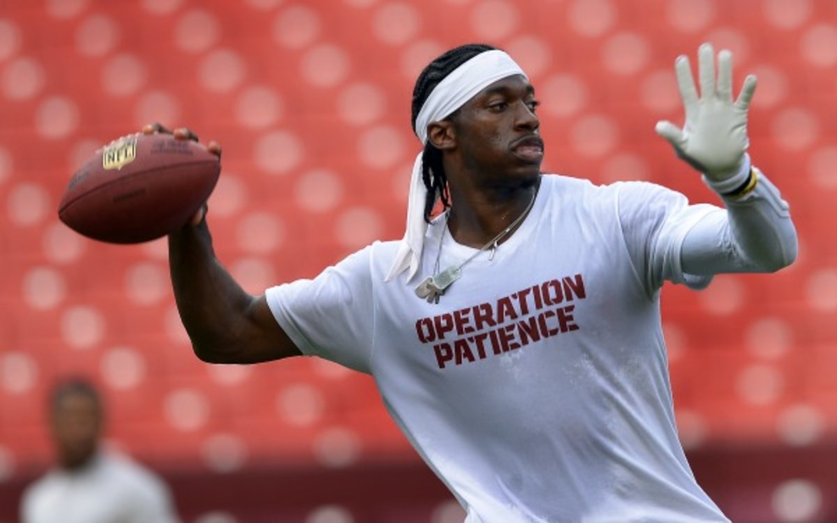 Robert Griffin III was fined for wearing an Adidas shirt during pregame. (Getty Images)