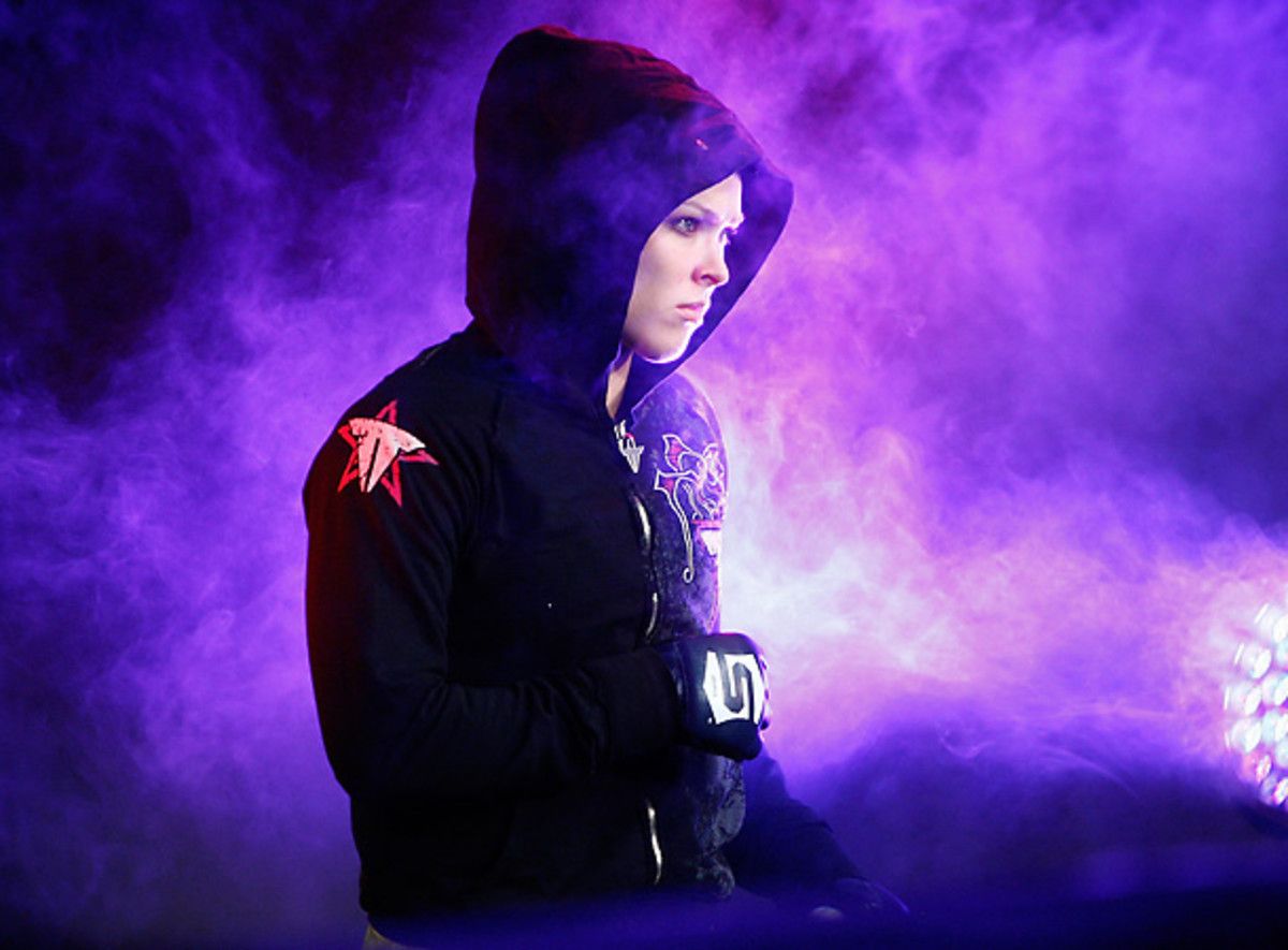 This was Ronda Rousey's demeanor before fighting Miesha Tate. Now she'll be living with her on a TV show. [Esther Lin/Getty Images]