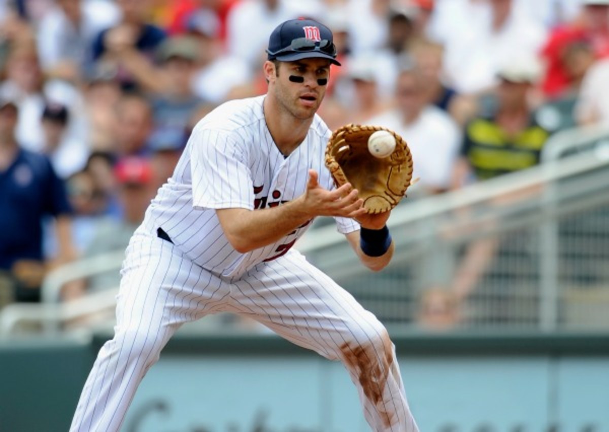 Joe Mauer played eight games at first base in 2013. (Hannah Foslien/Getty Images)