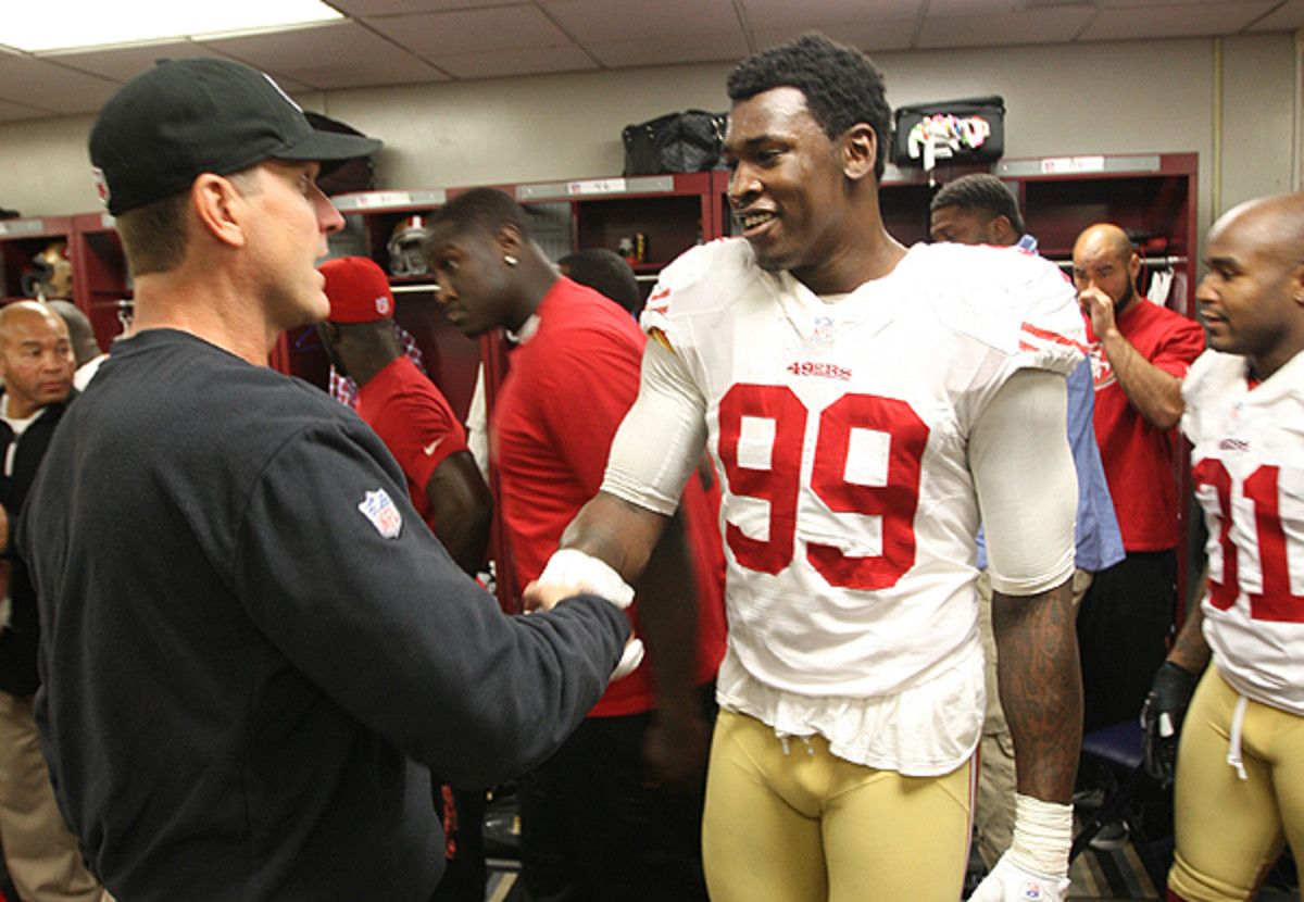 Jim Harbaugh is facing questions about his handling of OLB/DE Aldon Smith. (Michael Zagaris/Getty Images)