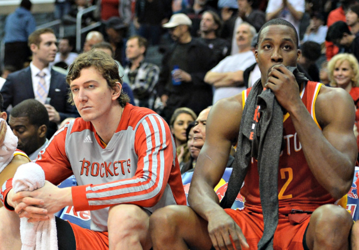 Omer Asik and Dwight Howard have struggled when sharing the court for the Rockets. (Harry How/Getty Images)