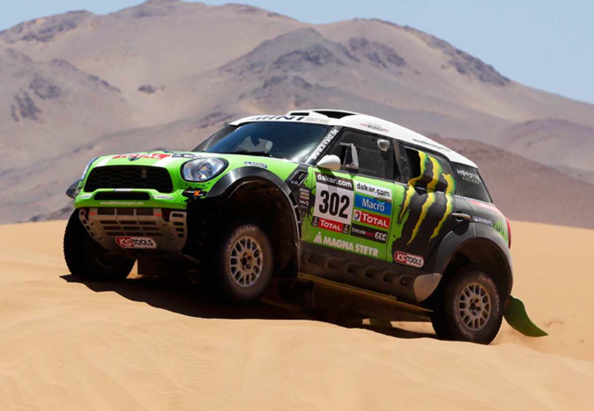 Frenchman Stephane Peterhansel maintained his overall lead after Stage 13 of the Dakar Rally.