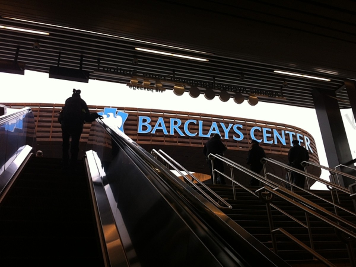 Riding the subway-station escalator up to the Barclays Center.