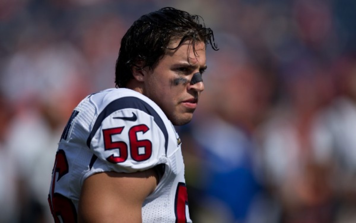 Brian Cushing was carted to the Texans' locker room with a left knee injury. (Justin Edmonds/Getty Images)