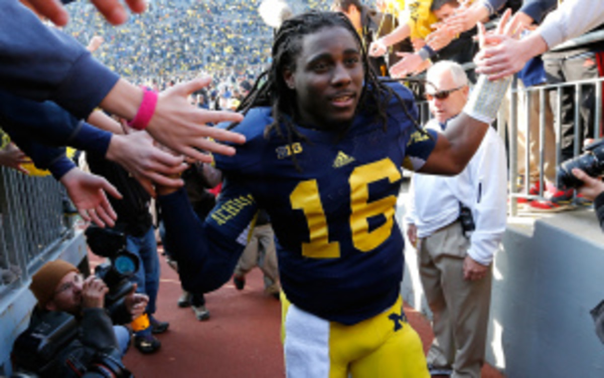 Former Michigan standout Denard Robinson signed a contract with the Jacksonville Jaguars on Tuesday, the team that drafted him last spring. (Gregory Shamus/Getty Images)