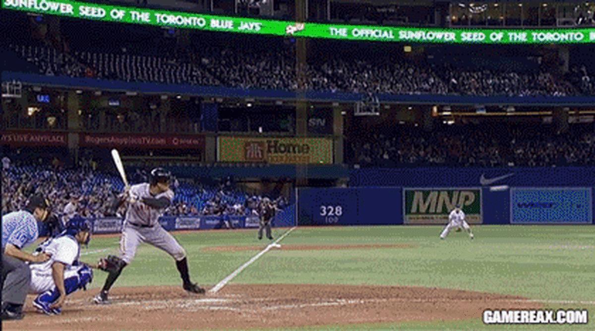 A fan catches a bat lost by Giants Hunter Pence.