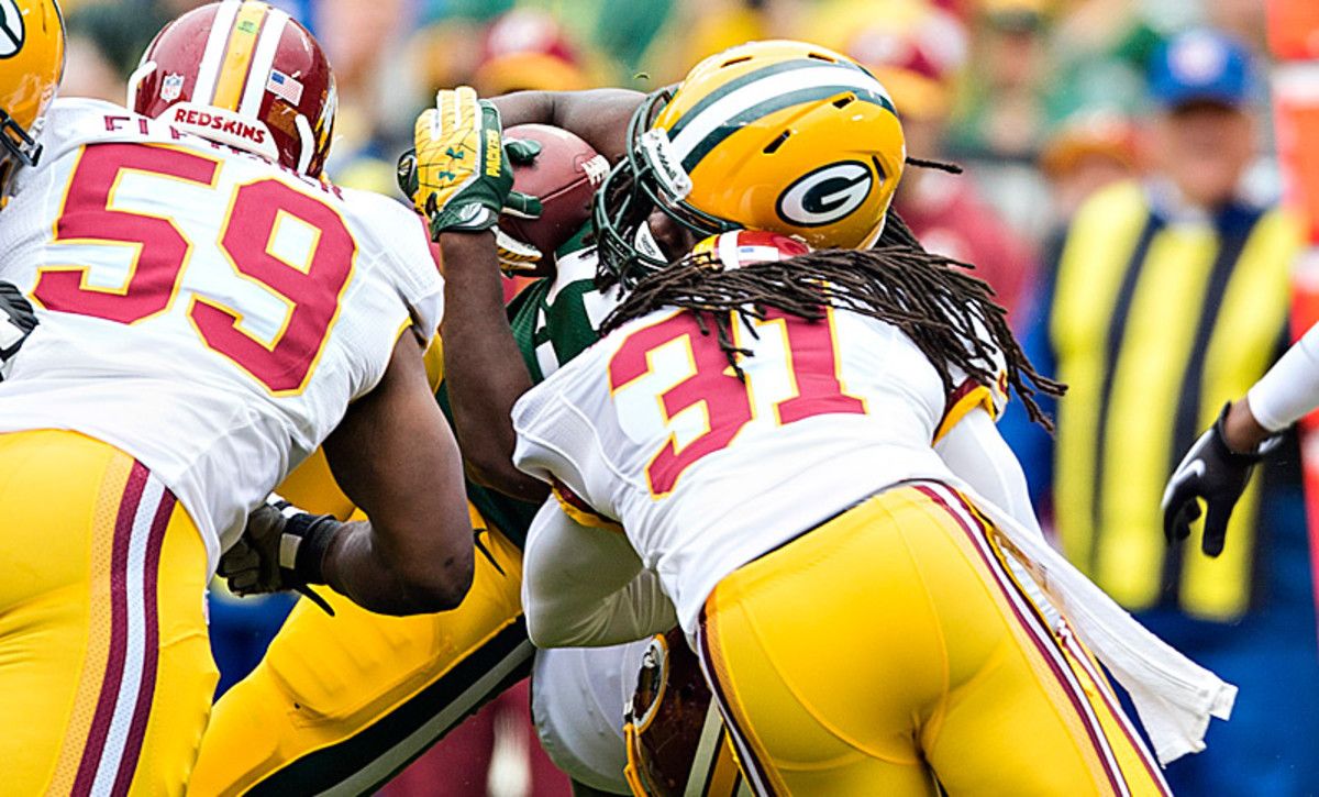 New rules outlawing helmet-to-helmet hits have brought about complaints from players and fans alike. (Wesley Hitt/Getty Images)