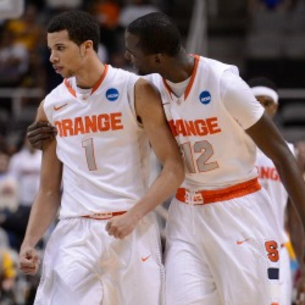 Syracuse sophomore Michael Carter Williams (left) said his family was OK after his house caught on fire during Saturday night's game. (Thearon W. Henderson/Getty Images)