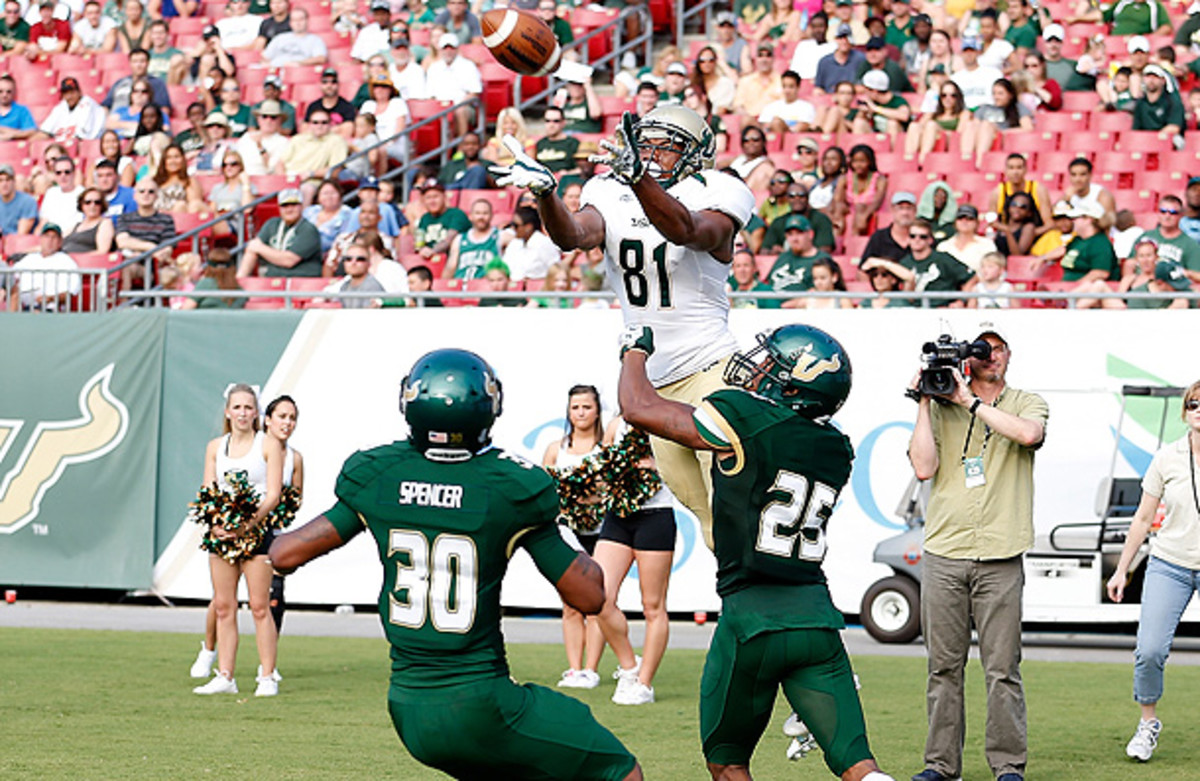 Josh Brown tackles teammate Andre Davis during their spring game. (J. Meric/Getty Images)