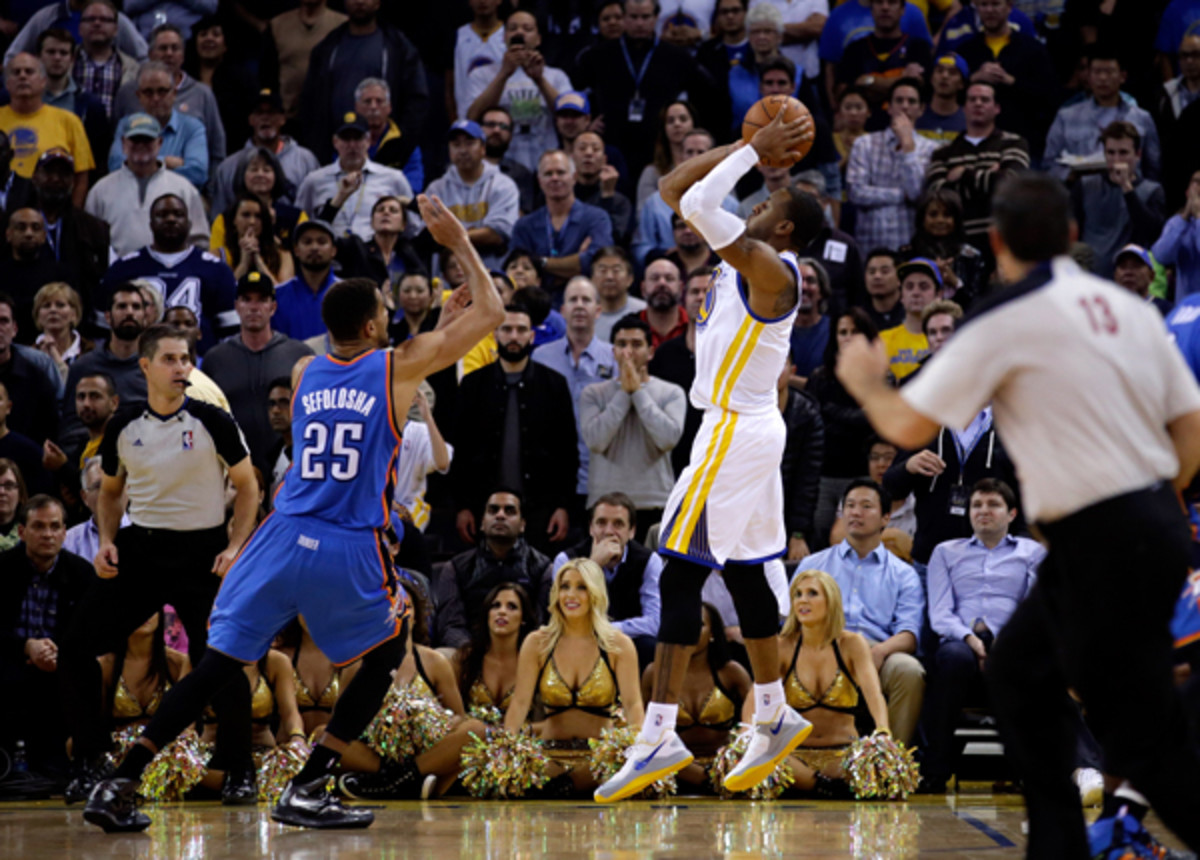 Andre Iguodala buries the game-winner over Thabo Sefolosha. (Ezra Shaw/Getty Images Sport)