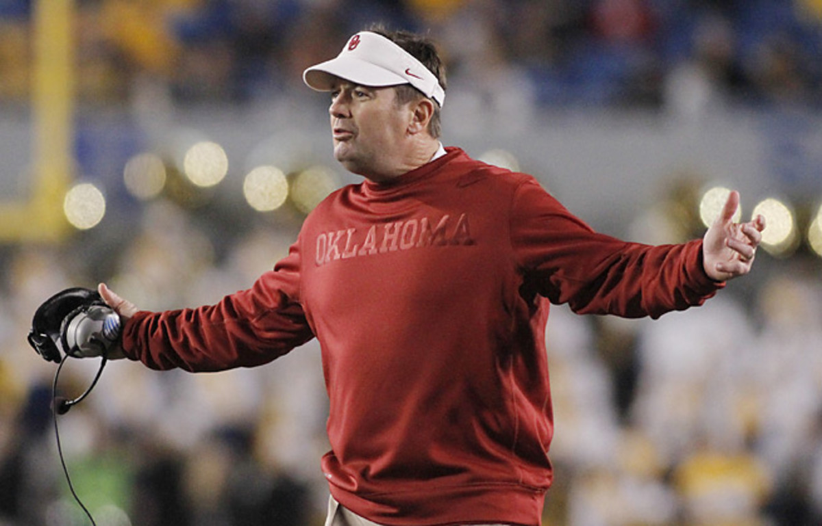 With Landry Jones gone, Bob Stoops has yet to decide who will start at QB for the Sooners this fall.