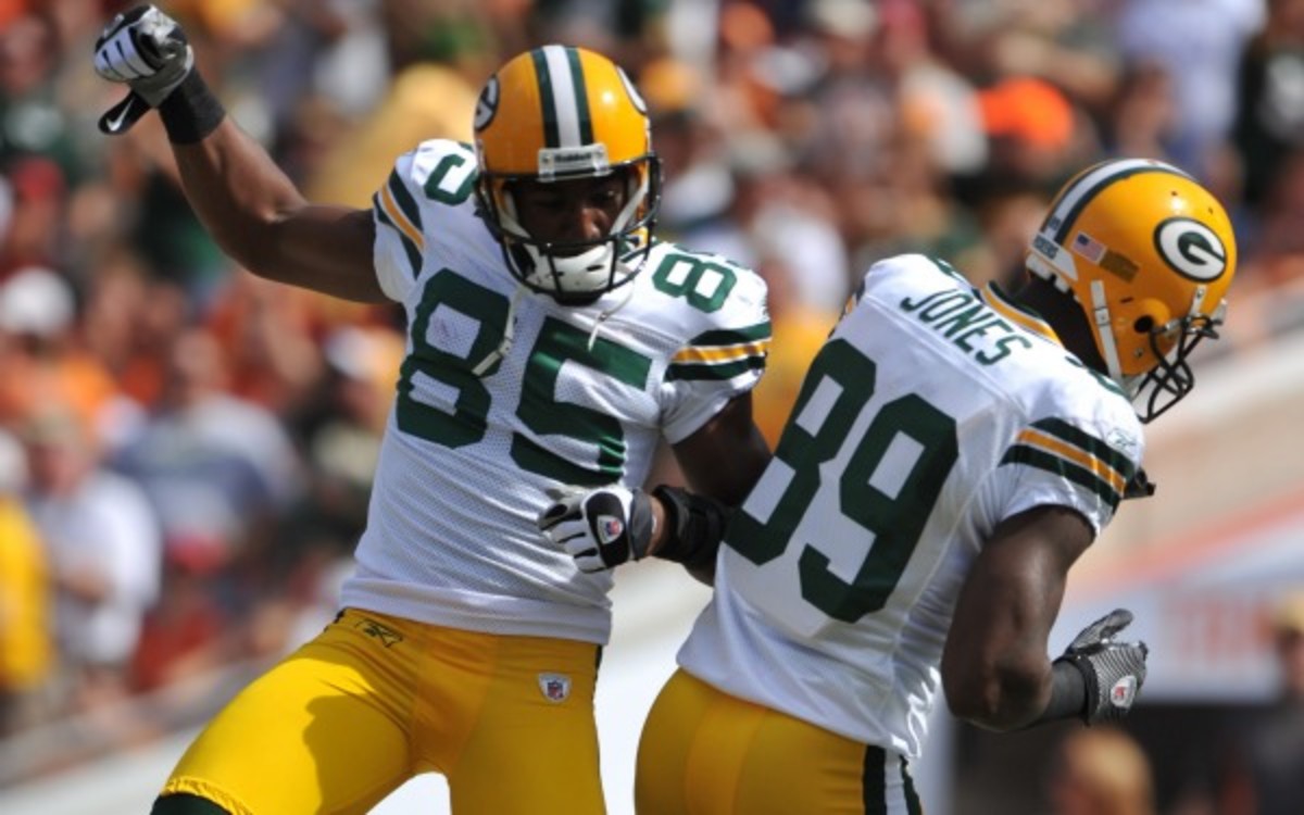 You won't see celebrations like this between James Jones and Greg Jennings anymore. (Larry French/Getty Images)