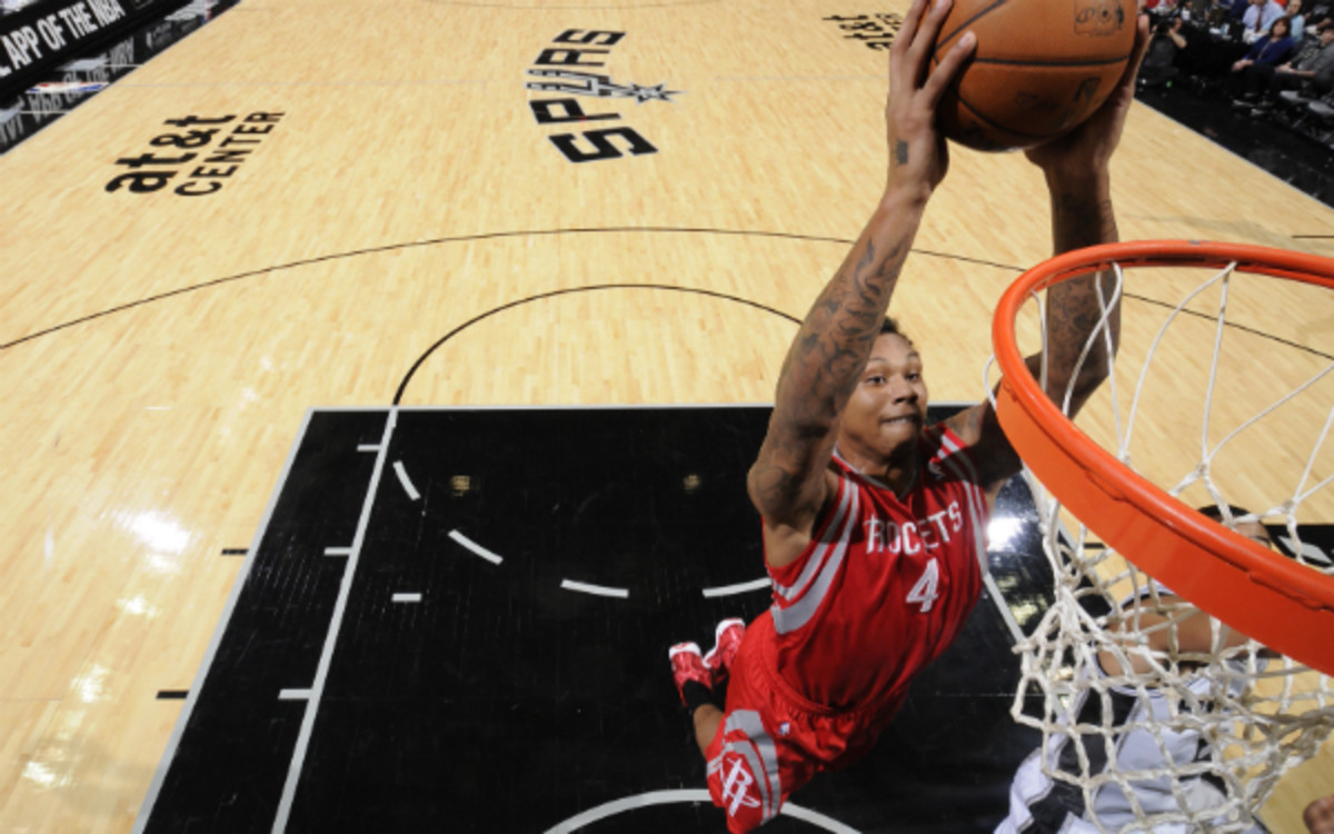 Rockets backup C Greg Smith leaves game with knee injury Sports