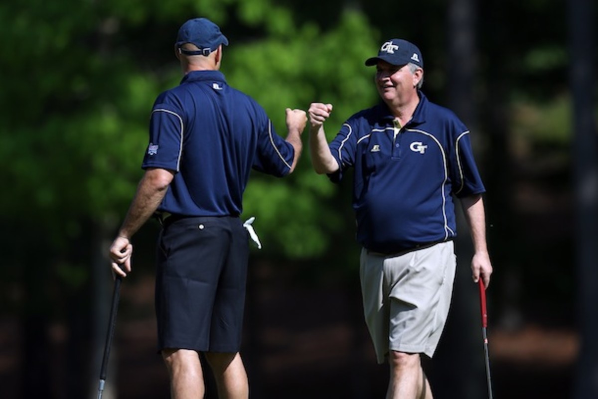 It's this kind of dedication to fist-bumping technique that gave Paul Johnson what he needed to knock off nationally ranked bumper Lane Kiffin in last year's Sun Bowl. (Courtesy of the Chick-fil-A Bowl)