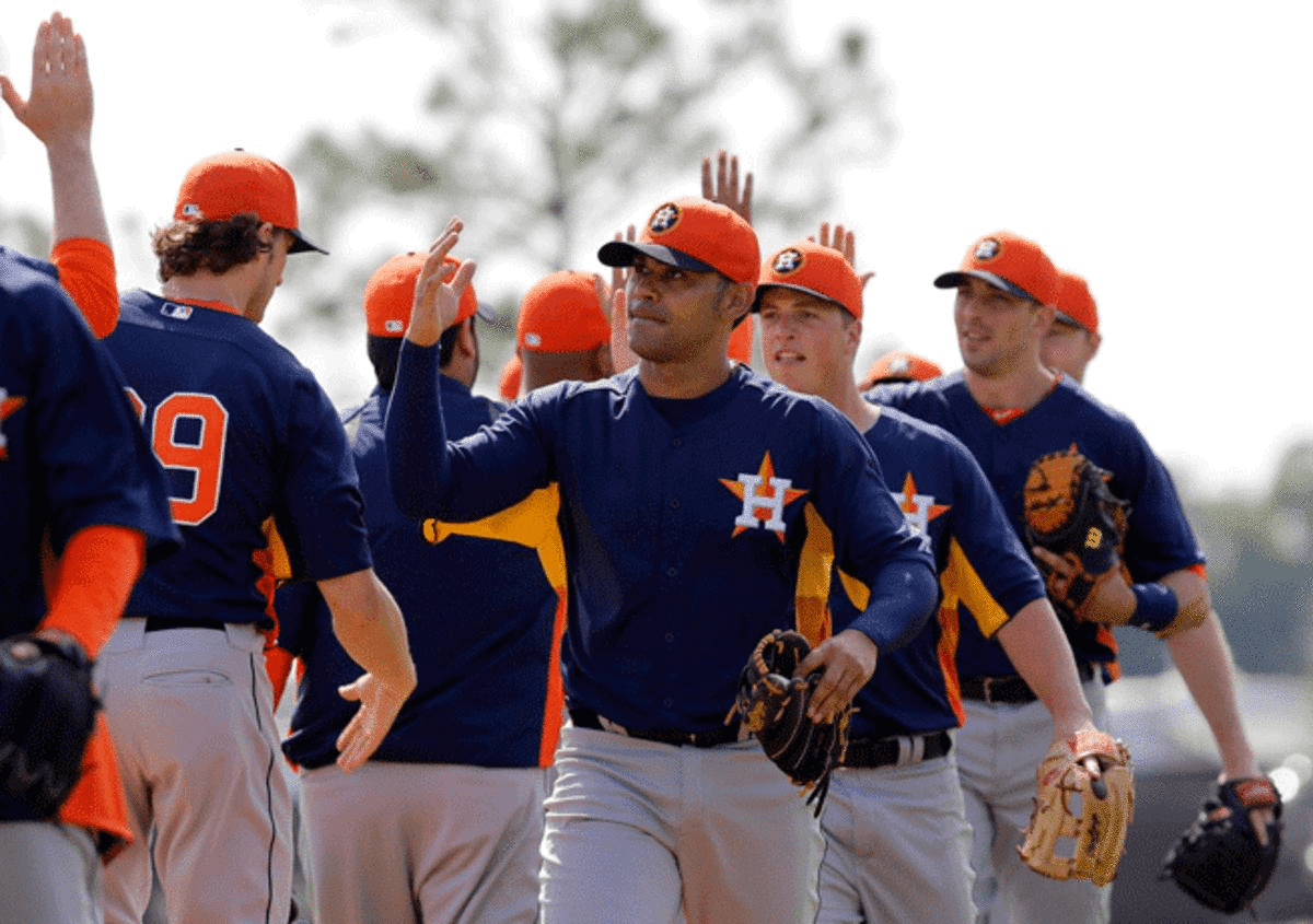 It's been a difficult season for Carlos Pena (center) and the Astros, but the team is trying to stay positive amidst all the losing.