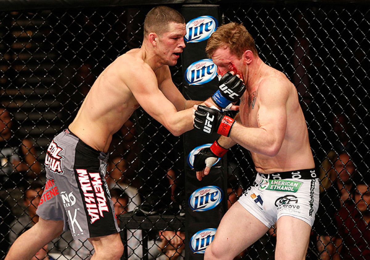 Nate Diaz (left) bloodied Gray Maynard during the deciding sequence in the first round.
