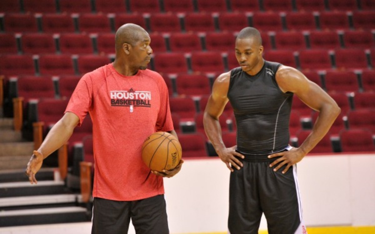 Hall of Famer Hakeem Olajuwon is seen working with Dwight Howard. (Bill Baptist/NBAE via Getty Images)